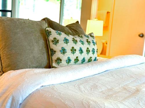a bed with two pillows on it with at Treetop-forest Flatsunit22 -four Seasons in Four Seasons