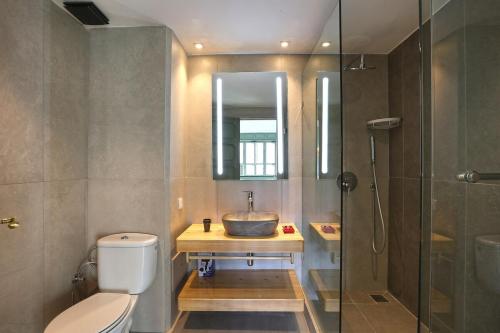 a bathroom with a sink and a toilet and a shower at Spacious 3Br Apartment-Pool&AC- Heart of Marrakech- Hivernage in Marrakech