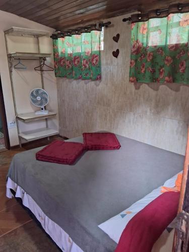 a bedroom with a large bed in a room at Bistrô Pousada Savacipó in Serra do Cipo