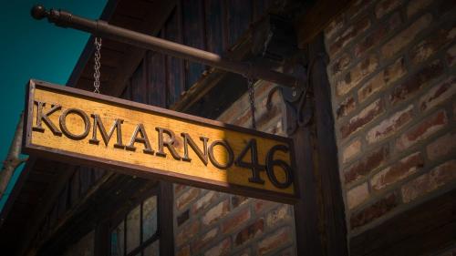 a sign that reads konamiokowa hanging on a brick wall at Domek pod Świerkami & Jacuzzi in Jelenia Góra