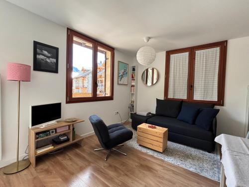 TV a/nebo společenská místnost v ubytování Le Lodge - Au coeur du village