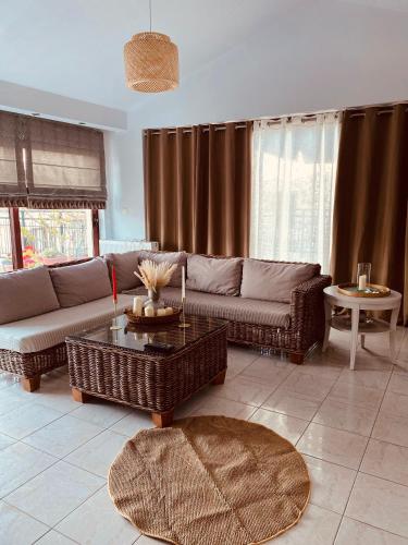 a living room with a couch and a table at Christina's Home in Skiathos Town