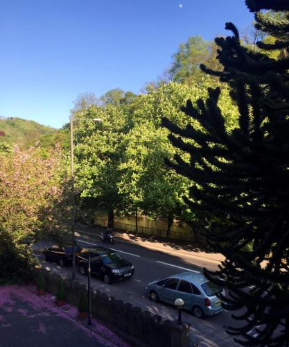 a street with cars parked in a parking lot at Ashdale Guesthouse in Matlock