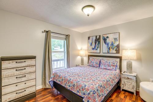 a bedroom with a bed and a window and a sink at 3 Mi to Cherokee Reservoir Blue Haven Bungalow in Morristown