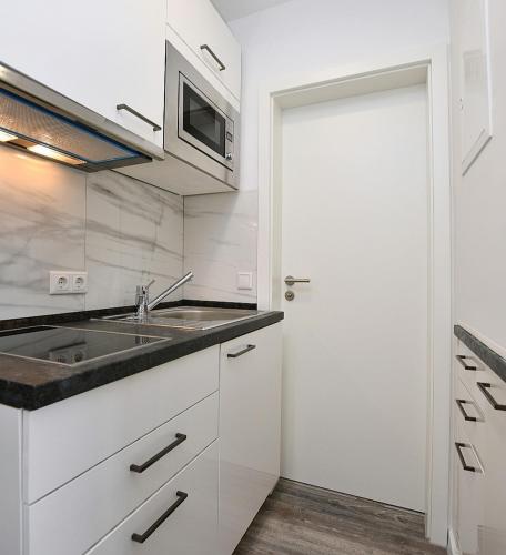 Dapur atau dapur kecil di City-Hotel Zuffenhausen - Apartments