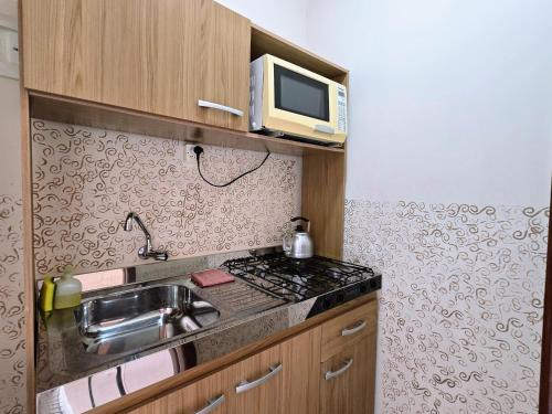 Η κουζίνα ή μικρή κουζίνα στο Residencial Borges Canela