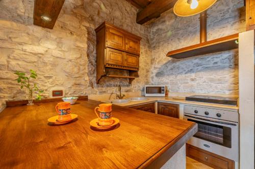 a kitchen with a wooden counter top in a room at Santa Teresa in Erice