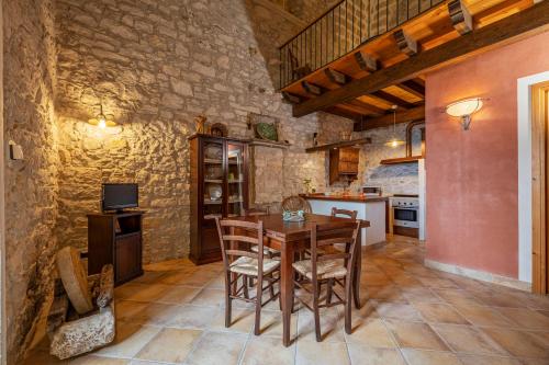 a kitchen and dining room with a table and chairs at Santa Teresa in Erice