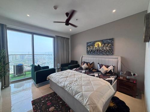 a bedroom with a bed and a ceiling fan at The Twilight Flora in Gurgaon