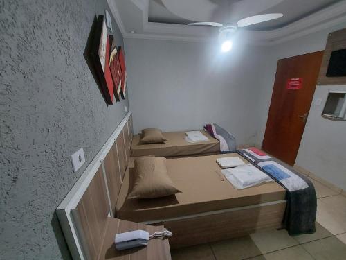 a small room with two beds in it at Hotel Luar in Sao Paulo