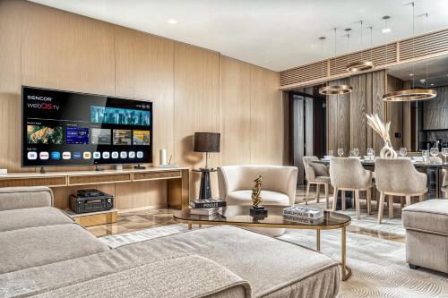 a living room with a couch and a table at FIVE Palm Jumeirah Premier Apartments in Dubai