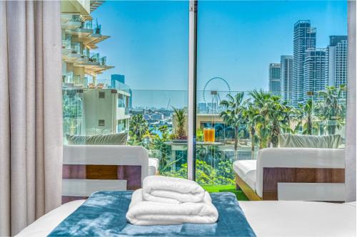a hotel room with a view of a city at FIVE Palm Jumeirah Premier Apartments in Dubai
