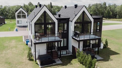 an aerial view of a house with windows at Villas Perspective Alphonse Spa and Mountain in Beaupré