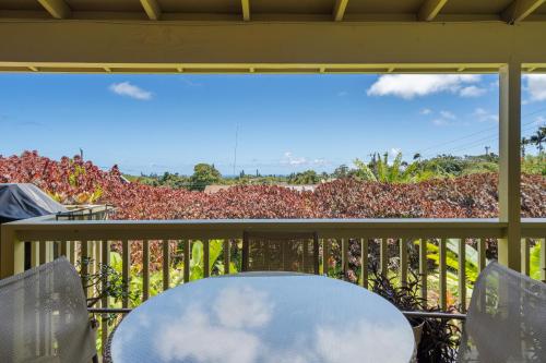 a white table and chairs on a balcony at 2 Mi to Hana Hwy Haiku Home with Ocean Views! in Haiku