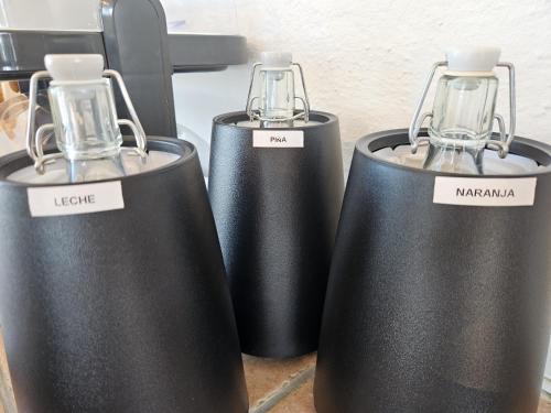 a group of three heaters sitting on a counter at La Roqueta Hotel in Tossa de Mar