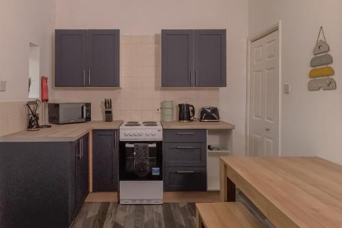 Kuchyň nebo kuchyňský kout v ubytování Halifax Hideaway - Free Parking