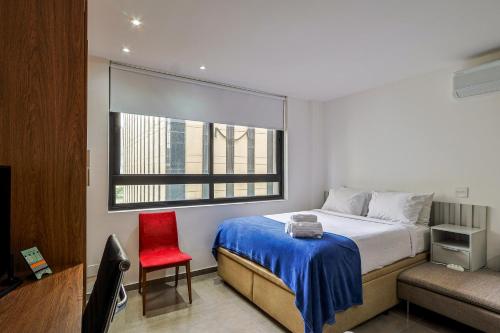 Ένα ή περισσότερα κρεβάτια σε δωμάτιο στο 360 Rio Santos Dumont