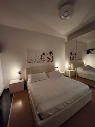 A bed or beds in a room at Varazzesuite apartment