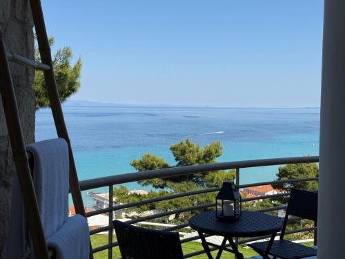 a view of the ocean from a balcony at Amelia Seaview Apartments & Studios in Kallithea Halkidikis