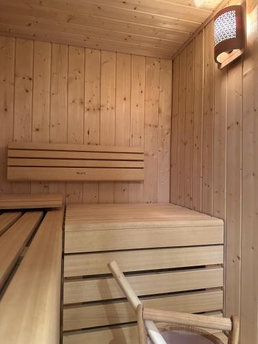 a wooden cabin with a bowling alley at La Dila Dolomiti Mountain Lodge in Andalo