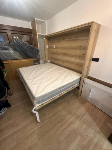 a bedroom with a bed in the corner of a room at Aral in La Pinilla