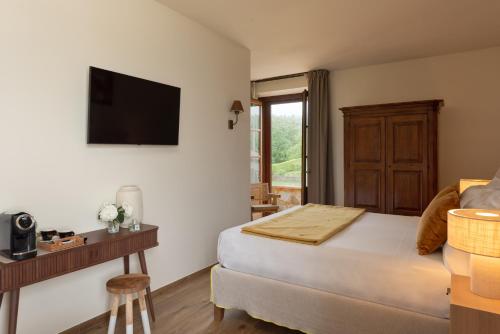 Postel nebo postele na pokoji v ubytování Poggio Paradiso Resort & Spa