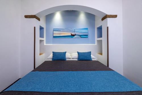Ένα ή περισσότερα κρεβάτια σε δωμάτιο στο B&B L'Angolino della nonna
