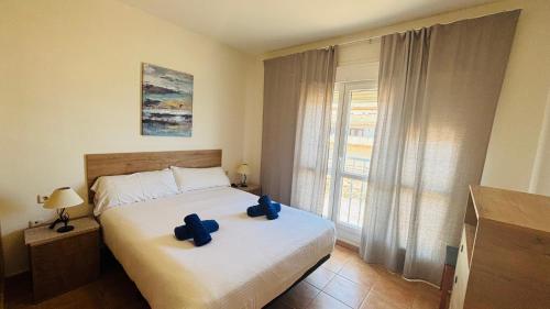 A bed or beds in a room at Holiday Apartment Casa Vista Mar Oliastur El Cotillo