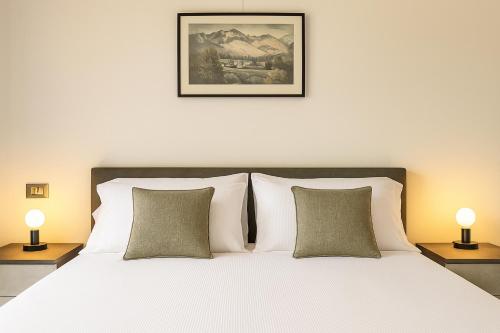 Ένα ή περισσότερα κρεβάτια σε δωμάτιο στο Lake Como Lario Apartment