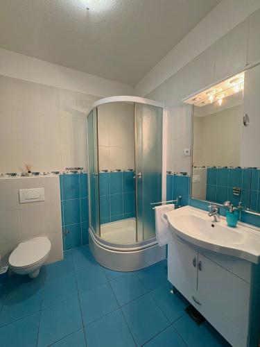 a bathroom with a shower and a toilet and a sink at Guest House Štorija, Vis Center, 1 min from Ferry in Vis