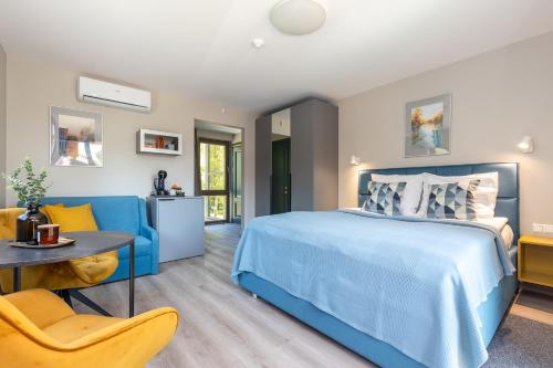 Ένα ή περισσότερα κρεβάτια σε δωμάτιο στο Orange Holiday