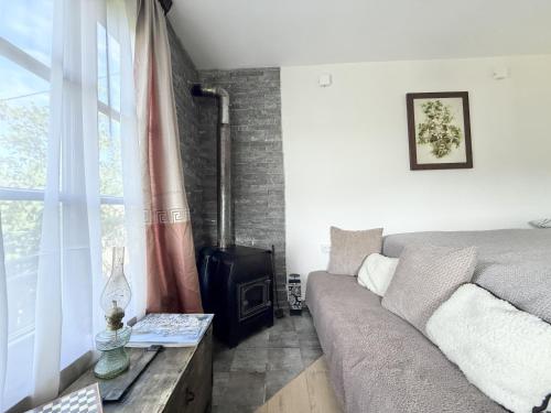 a living room with a couch and a fireplace at Kiketi Paradise 2 in Kiketʼi
