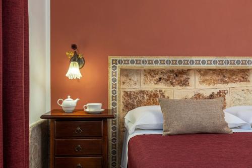 Ένα ή περισσότερα κρεβάτια σε δωμάτιο στο B&B L'Angolino della nonna