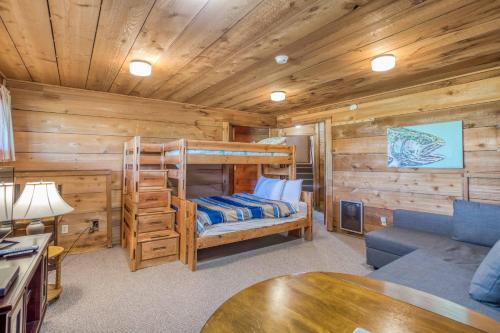 a log cabin with a bunk bed and a couch at A Beachfront Fantasea in Lincoln City