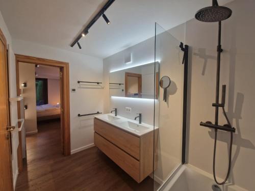 a bathroom with a sink and a shower at Villa Marsel Oostduinkerke in Oostduinkerke