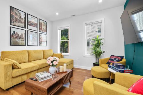 a living room with two couches and a coffee table at 3BR2Bth TD Garden BOS MIT Harvard 2 Parking Spaces in Somerville