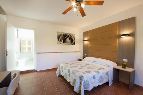 Säng eller sängar i ett rum på Antica Melegnano