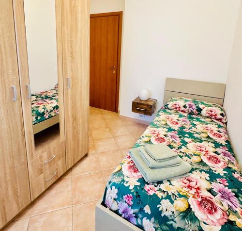 Postel nebo postele na pokoji v ubytování Gli Agrumi di nonna Peppina - Appartamento Arance