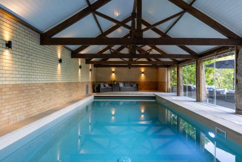 a swimming pool in a house with a large at H Oxencombe Farm House in Newton Abbot