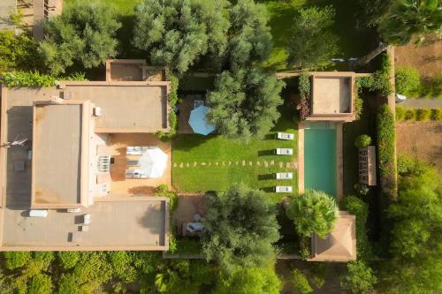 an overhead view of a house with a yard at Luxueuse villa VALERIA avec gouvernante in Chaibate