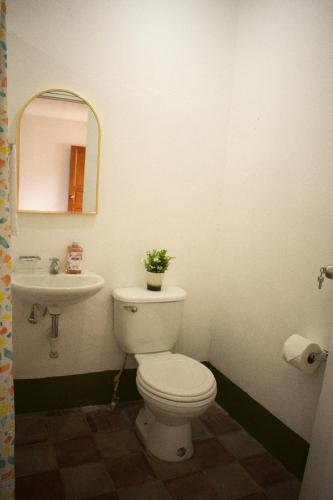 a bathroom with a toilet and a sink at Casa Girasol in Granada