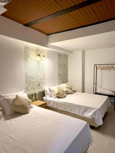 Postel nebo postele na pokoji v ubytování Ivanna Hotel Campestre
