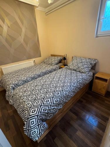 Ένα ή περισσότερα κρεβάτια σε δωμάτιο στο NIKA Apartman