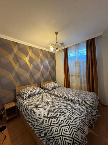 Ένα ή περισσότερα κρεβάτια σε δωμάτιο στο NIKA Apartman