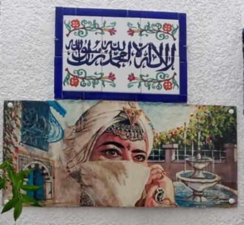 a picture of a painting of a woman at Dar El Kasba Riad Guest House in Bizerte