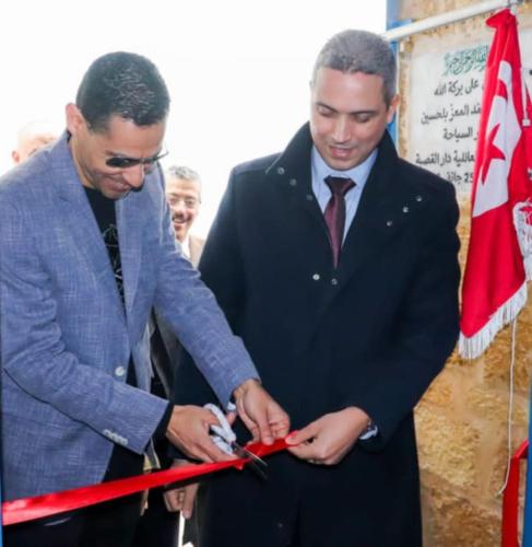 two men cutting a ribbon with a pair of scissors at Dar El Kasba Riad Guest House in Bizerte