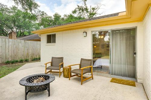 a patio with chairs and a table and a fire pit at 5 Mi to Lake Houston Family Home in Humble in Humble