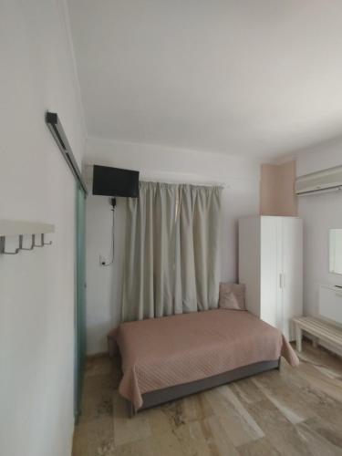 Ένα ή περισσότερα κρεβάτια σε δωμάτιο στο GIOTA ROOMS