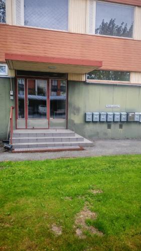 a building with steps in front of a building at Sun in Närpiö