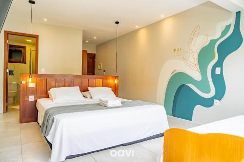 a bedroom with two beds in a room at Pousada Recanto Nalu - Quarto à Vista in Pipa